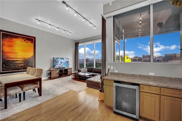 360 E Desert Inn Rd Unit 1803, Las Vegas, NV 89109 - living area with wine cooler, light wood-style flooring, a dry bar, and rail lighting