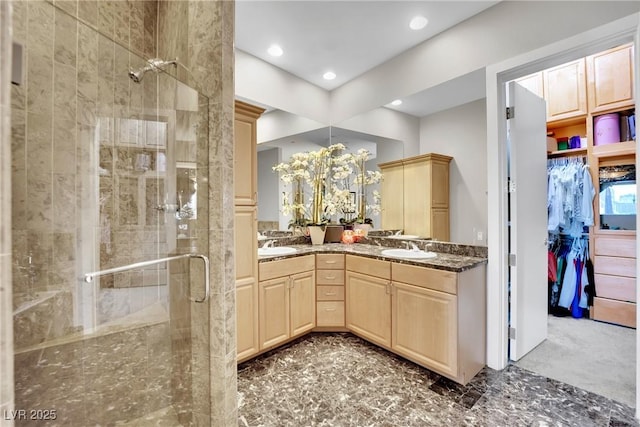 360 E Desert Inn Rd Unit 1803, Las Vegas, NV 89109 - bathroom featuring a shower stall, double vanity, recessed lighting, and a spacious closet