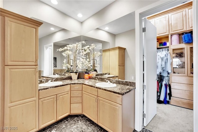 360 E Desert Inn Rd Unit 1803, Las Vegas, NV 89109 - bathroom with double vanity, recessed lighting, and a walk in closet