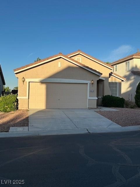 3416 Mountain Park St, Las Vegas, NV 89129 - ranch-style home featuring a garage, driveway, and stucco siding