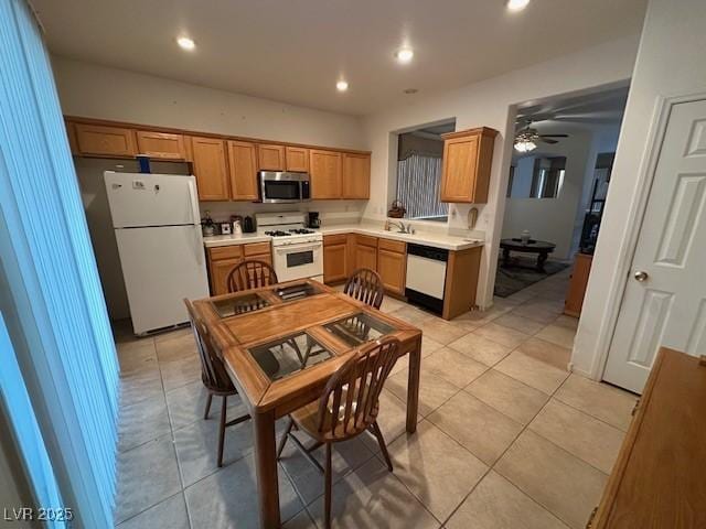 3416 Mountain Park St, Las Vegas, NV 89129 - kitchen featuring white appliances, ceiling fan, light tile patterned floors, light countertops, and recessed lighting