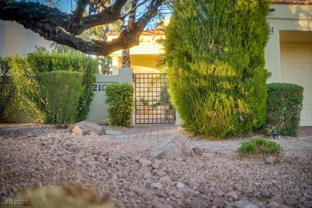 2104 Inverness Dr, Henderson, NV 89074 - view of front facade with a gate and stucco siding