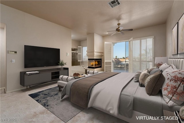 2104 Inverness Dr, Henderson, NV 89074 - bedroom with a large fireplace, carpet floors, and ceiling fan