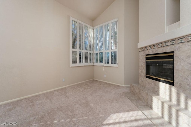 2104 Inverness Dr, Henderson, NV 89074 - unfurnished living room with lofted ceiling, a premium fireplace, and carpet flooring