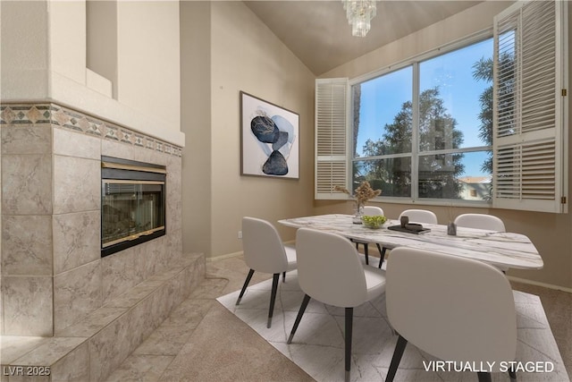 2104 Inverness Dr, Henderson, NV 89074 - dining space featuring vaulted ceiling, carpet floors, and a fireplace
