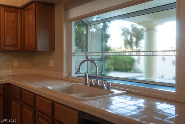 2104 Inverness Dr, Henderson, NV 89074 - kitchen with tile counters and brown cabinets