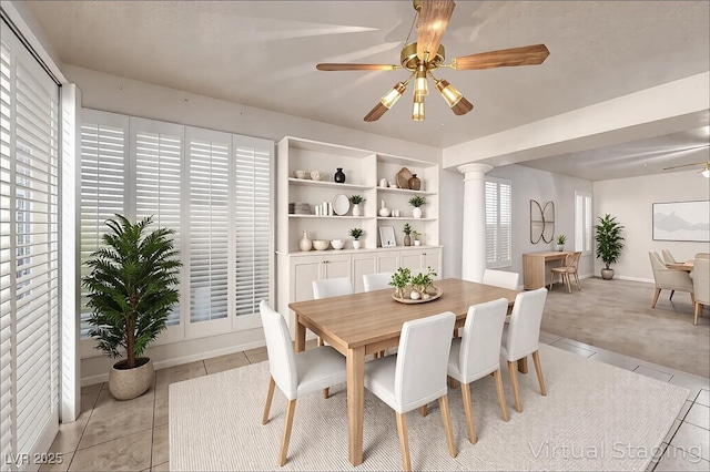 2104 Inverness Dr, Henderson, NV 89074 - dining space featuring light tile patterned flooring, decorative columns, and ceiling fan