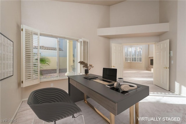 2104 Inverness Dr, Henderson, NV 89074 - home office featuring a towering ceiling and carpet flooring