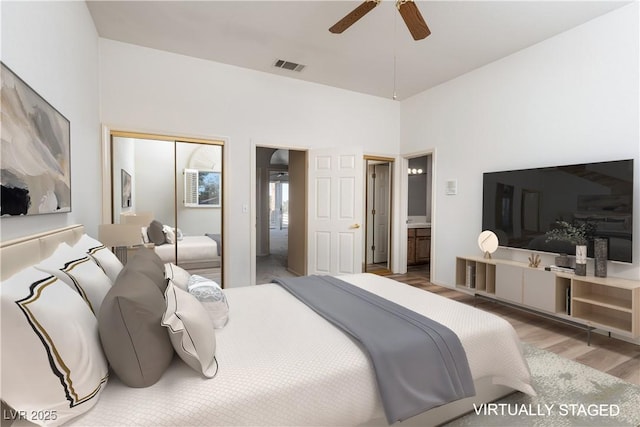 2104 Inverness Dr, Henderson, NV 89074 - bedroom with wood finished floors, a closet, and a ceiling fan