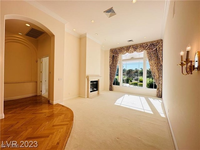2017 Eagle Trace Way, Las Vegas, NV 89117 - unfurnished living room featuring ornamental molding, baseboards, arched walkways, a glass covered fireplace, and recessed lighting