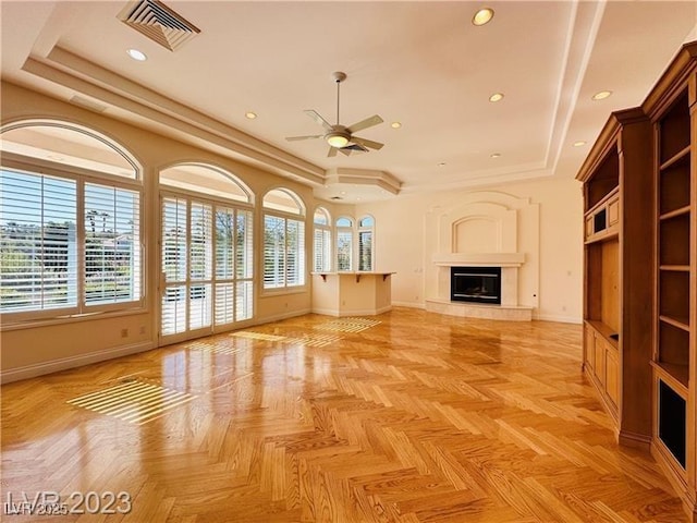 2017 Eagle Trace Way, Las Vegas, NV 89117 - unfurnished living room with a tray ceiling, baseboards, ceiling fan, recessed lighting, and a fireplace