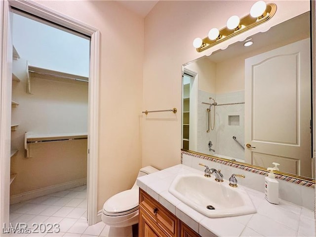 2017 Eagle Trace Way, Las Vegas, NV 89117 - bathroom featuring vanity, a shower, toilet, tile patterned floors, and a walk in closet