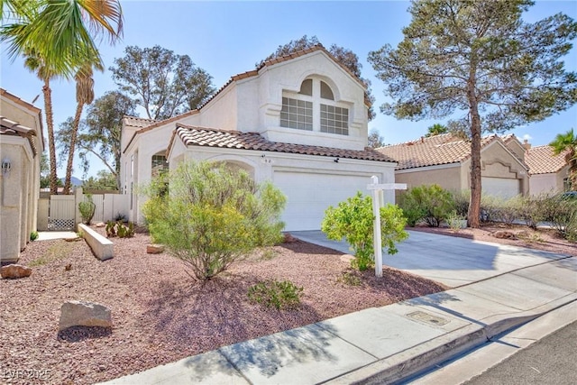 92 Sea Holly Way, Henderson, NV 89074 - mediterranean / spanish home with a tiled roof, concrete driveway, stucco siding, and a garage