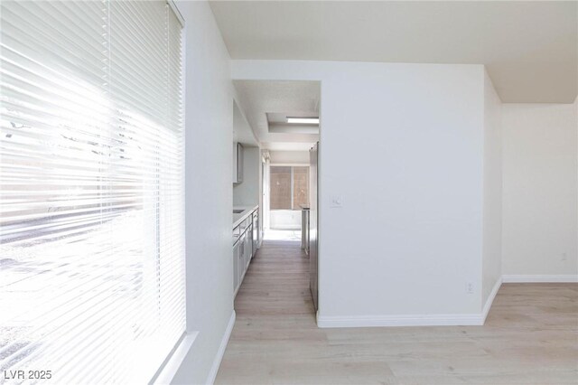 92 Sea Holly Way, Henderson, NV 89074 - hall featuring light wood-style floors and attic access