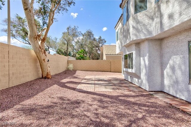 92 Sea Holly Way, Henderson, NV 89074 - fenced backyard with a patio area