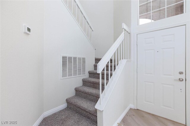 92 Sea Holly Way, Henderson, NV 89074 - stairs with a towering ceiling and wood finished floors