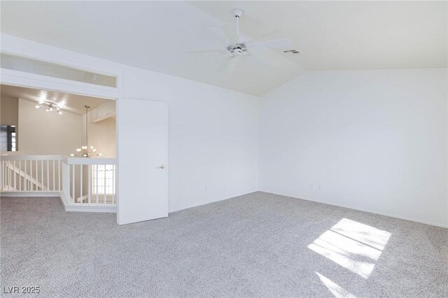 92 Sea Holly Way, Henderson, NV 89074 - spare room featuring lofted ceiling, carpet floors, a chandelier, and a ceiling fan