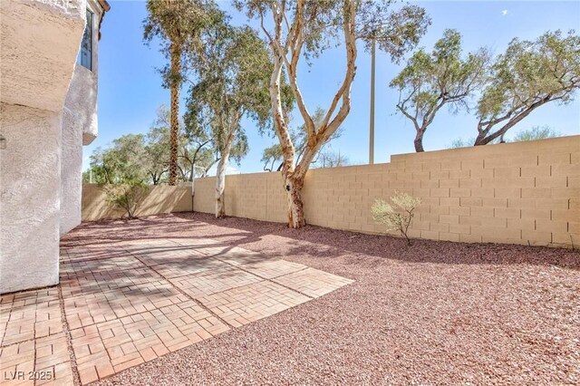 92 Sea Holly Way, Henderson, NV 89074 - fenced backyard with a patio