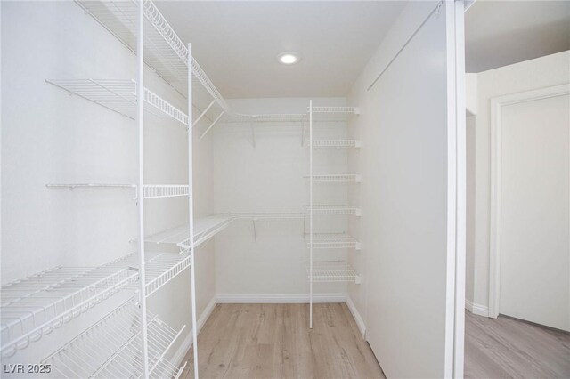 92 Sea Holly Way, Henderson, NV 89074 - spacious closet featuring light wood-style floors