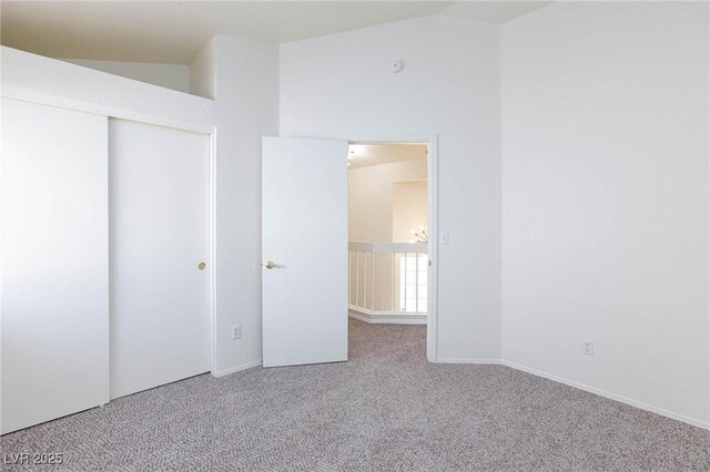 92 Sea Holly Way, Henderson, NV 89074 - unfurnished bedroom with carpet flooring, lofted ceiling, and a closet