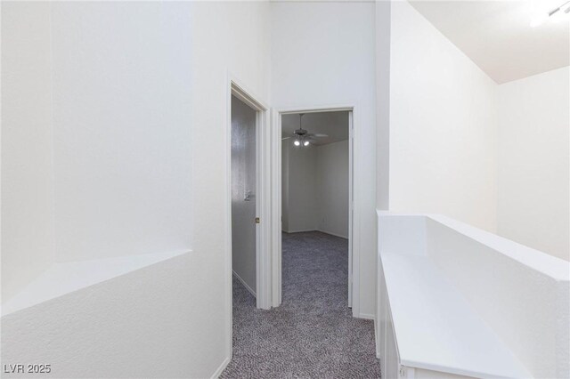 92 Sea Holly Way, Henderson, NV 89074 - hall with carpet floors and an upstairs landing