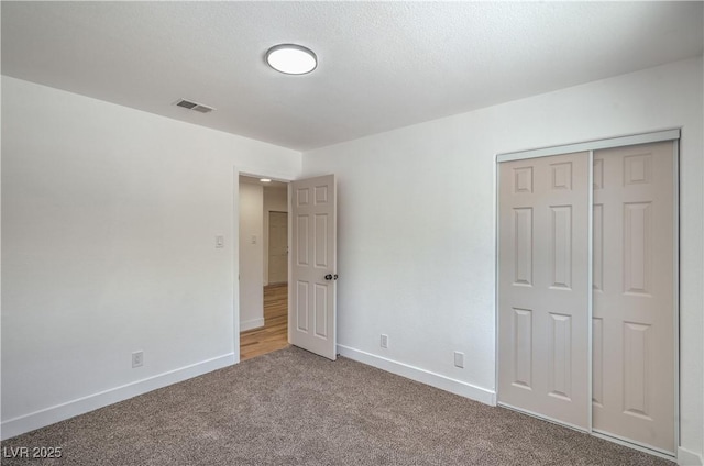 5279 Consul Ave, Las Vegas, NV 89142 - unfurnished bedroom with baseboards, carpet flooring, and a closet