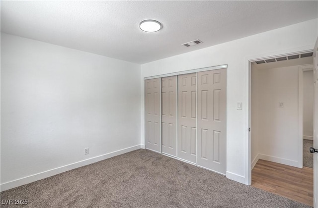5279 Consul Ave, Las Vegas, NV 89142 - unfurnished bedroom with baseboards, carpet floors, and a closet