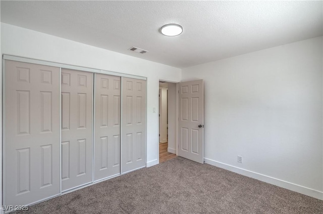 5279 Consul Ave, Las Vegas, NV 89142 - unfurnished bedroom featuring carpet floors, baseboards, and a closet