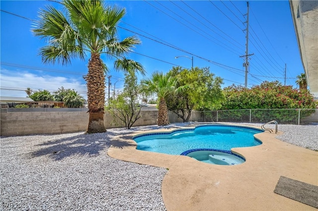 5279 Consul Ave, Las Vegas, NV 89142 - view of pool featuring a fenced backyard, a pool with connected hot tub, and a patio