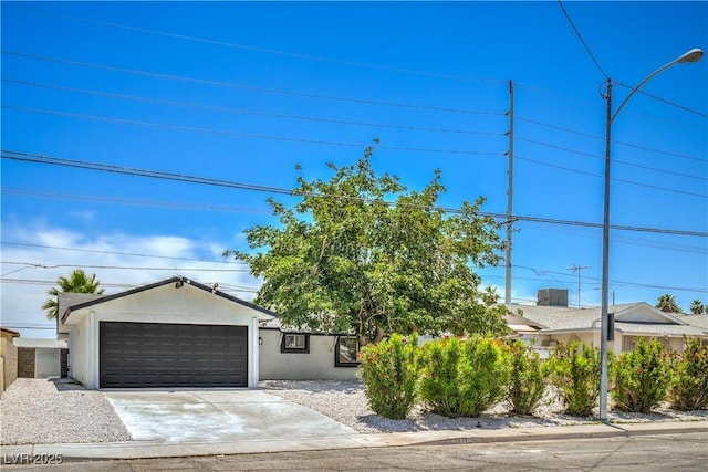 5279 Consul Ave, Las Vegas, NV 89142 - view of front facade featuring a garage and stucco siding