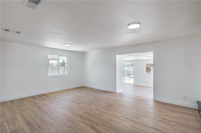 5279 Consul Ave, Las Vegas, NV 89142 - spare room featuring plenty of natural light, light wood-style floors, and baseboards