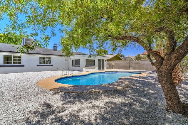 5279 Consul Ave, Las Vegas, NV 89142 - view of pool featuring a fenced backyard, a patio area, and central air condition unit