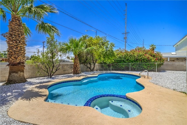5279 Consul Ave, Las Vegas, NV 89142 - view of swimming pool with a pool with connected hot tub and a fenced backyard