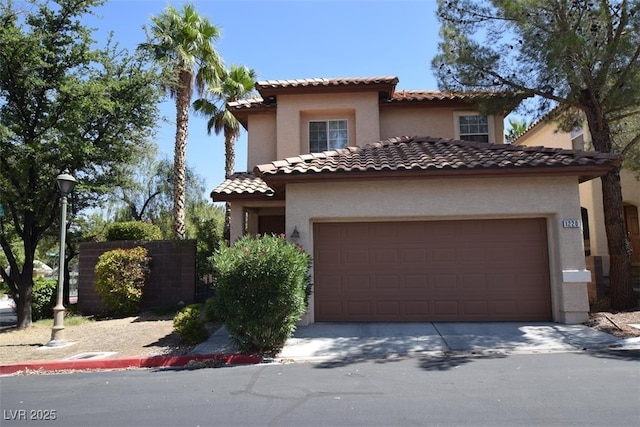 1220 Padre Serra Ln, Las Vegas, NV 89134 - mediterranean / spanish-style home with a tiled roof, an attached garage, stucco siding, and concrete driveway