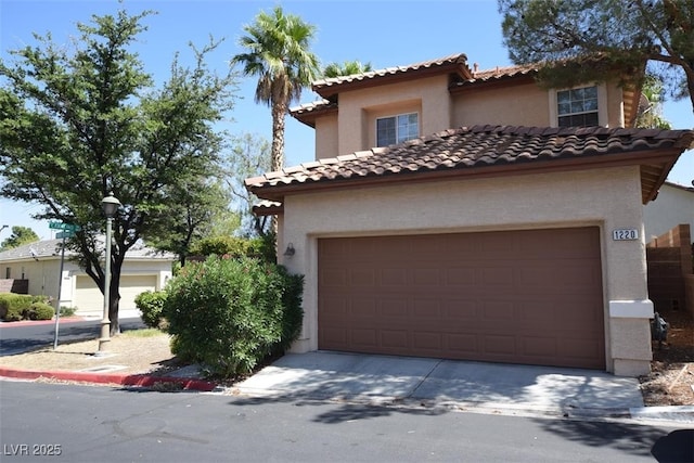 1220 Padre Serra Ln, Las Vegas, NV 89134 - mediterranean / spanish-style home featuring stucco siding, a tiled roof, and driveway