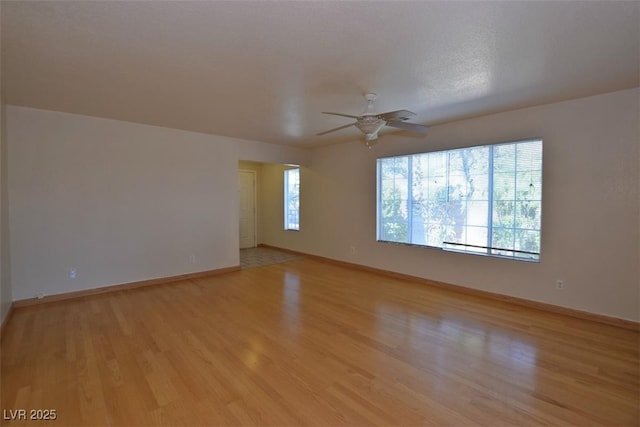 1220 Padre Serra Ln, Las Vegas, NV 89134 - spare room with light wood-type flooring, ceiling fan, and baseboards