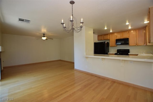 1220 Padre Serra Ln, Las Vegas, NV 89134 - kitchen featuring black appliances, tile countertops, light wood-style flooring, ceiling fan, and baseboards