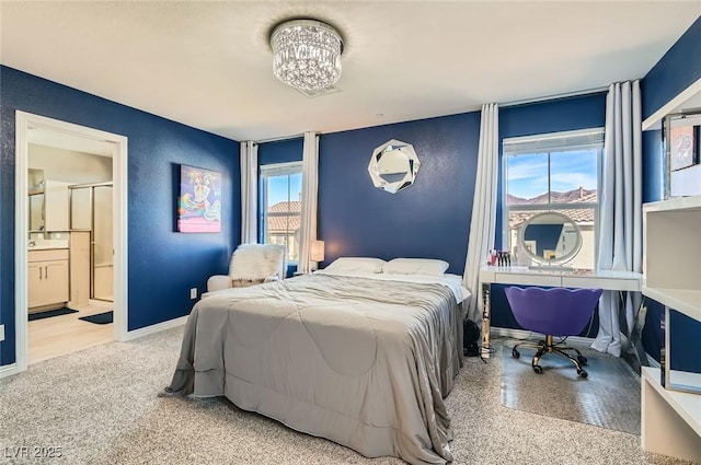 2806 Calle Cadiz, Henderson, NV 89044 - bedroom with a chandelier, ensuite bath, and baseboards