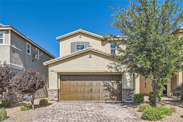 2806 Calle Cadiz, Henderson, NV 89044 - view of front of home featuring a tile roof, stucco siding, decorative driveway, and stone siding