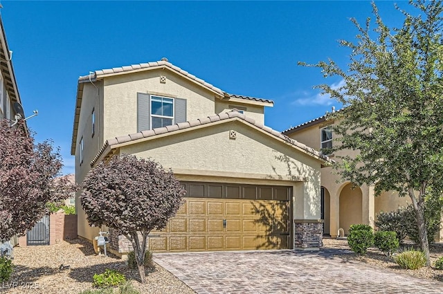 2806 Calle Cadiz, Henderson, NV 89044 - mediterranean / spanish-style home with stucco siding, a tiled roof, and decorative driveway