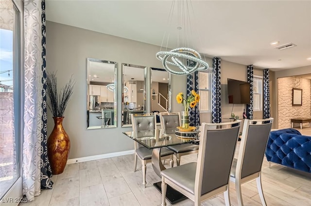 2806 Calle Cadiz, Henderson, NV 89044 - dining space with a chandelier, wood finished floors, baseboards, and recessed lighting