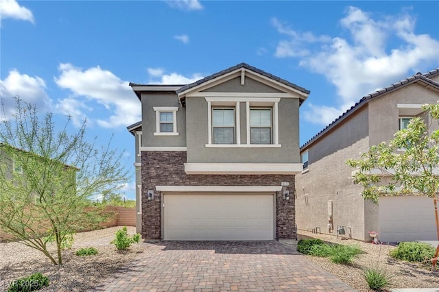 10345 Zebra Swallowtail St, Las Vegas, NV 89141 - traditional home with stone siding, stucco siding, decorative driveway, and a garage