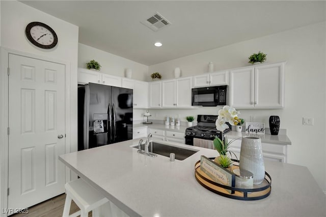 10345 Zebra Swallowtail St, Las Vegas, NV 89141 - kitchen featuring black appliances, a sink, white cabinets, light countertops, and recessed lighting