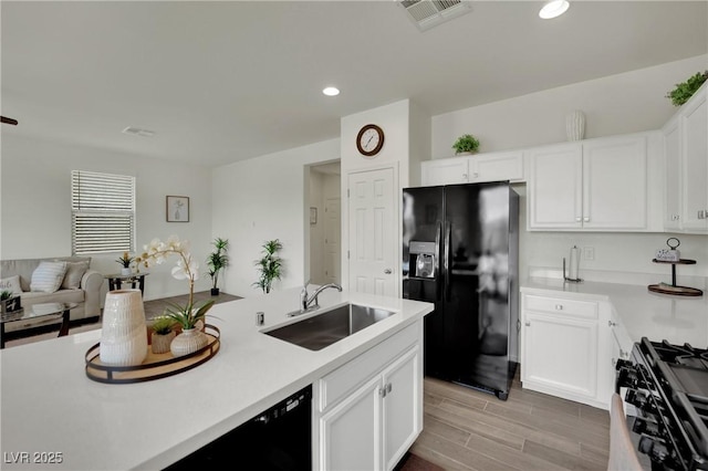 10345 Zebra Swallowtail St, Las Vegas, NV 89141 - kitchen with black appliances, a sink, light countertops, white cabinetry, and recessed lighting