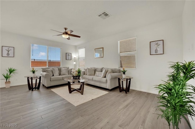 10345 Zebra Swallowtail St, Las Vegas, NV 89141 - living area featuring a ceiling fan, light wood finished floors, and baseboards