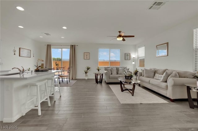 10345 Zebra Swallowtail St, Las Vegas, NV 89141 - living room featuring ceiling fan, recessed lighting, and light wood-type flooring