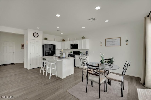 10345 Zebra Swallowtail St, Las Vegas, NV 89141 - dining room with wood finished floors, recessed lighting, and baseboards
