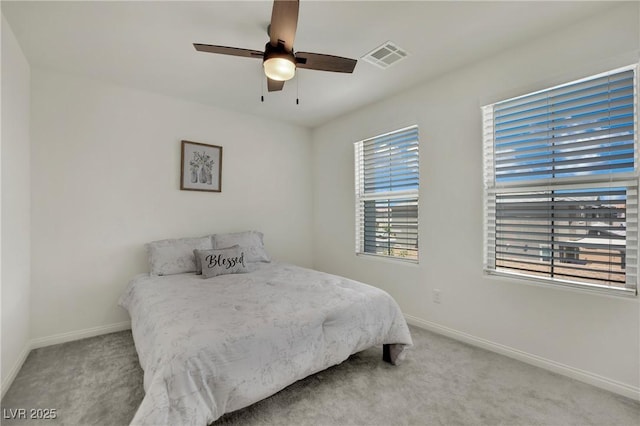 10345 Zebra Swallowtail St, Las Vegas, NV 89141 - carpeted bedroom featuring baseboards, multiple windows, and ceiling fan