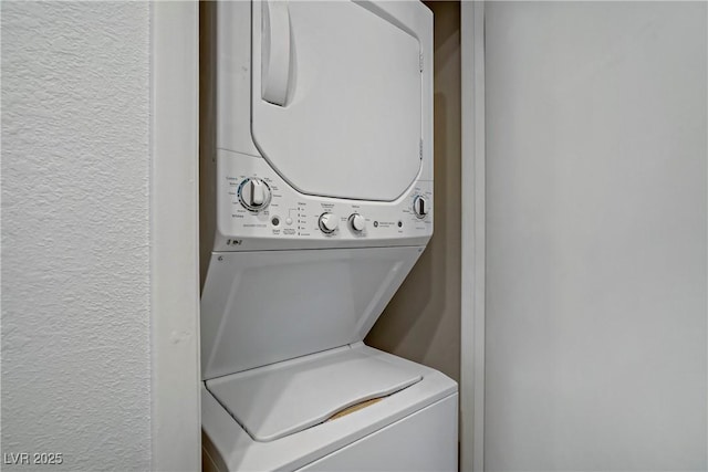 5171 Lindell Rd Unit 201, Las Vegas, NV 89118 - laundry room featuring stacked washer and clothes dryer and a textured wall