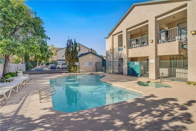 5171 Lindell Rd Unit 201, Las Vegas, NV 89118 - community pool with a patio area and a residential view